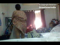 Sexy Indian Bengali Aunt Mili captured changing in bedroom